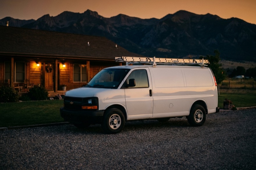 Utah Energy Pros work van at a home at dusk